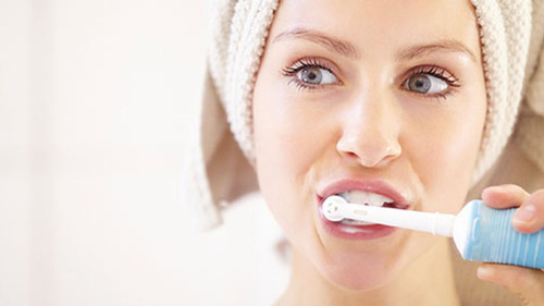why would a dentist recommend an electric toothbrush with ultrasound technology?